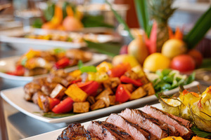 Buffet table with sliced roast beef and fresh fruit, a Food & Drink Photo by AlyaAnd