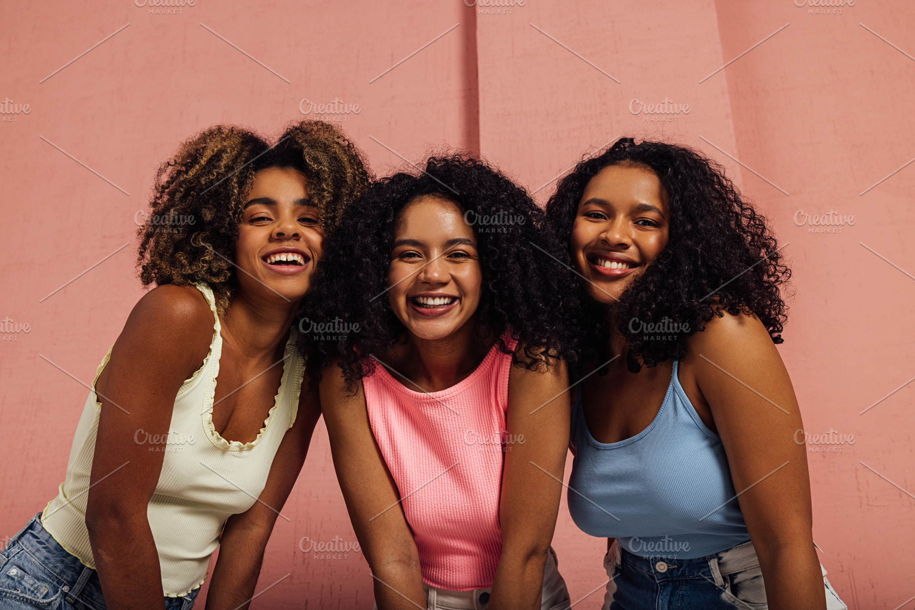 Three happy girls with curly hair, a Person Photo by Artem Varnitsin