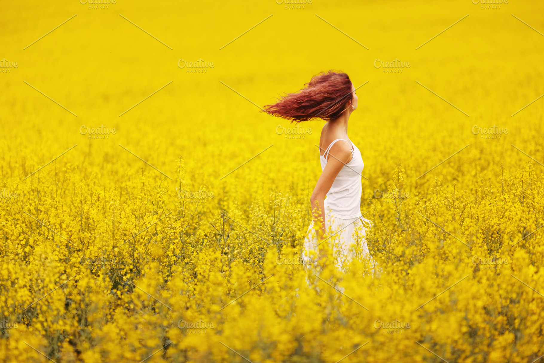 Beautiful girl in the yellow field stock photo containing adult and beautiful, a Person Photo by AlohaHawaii