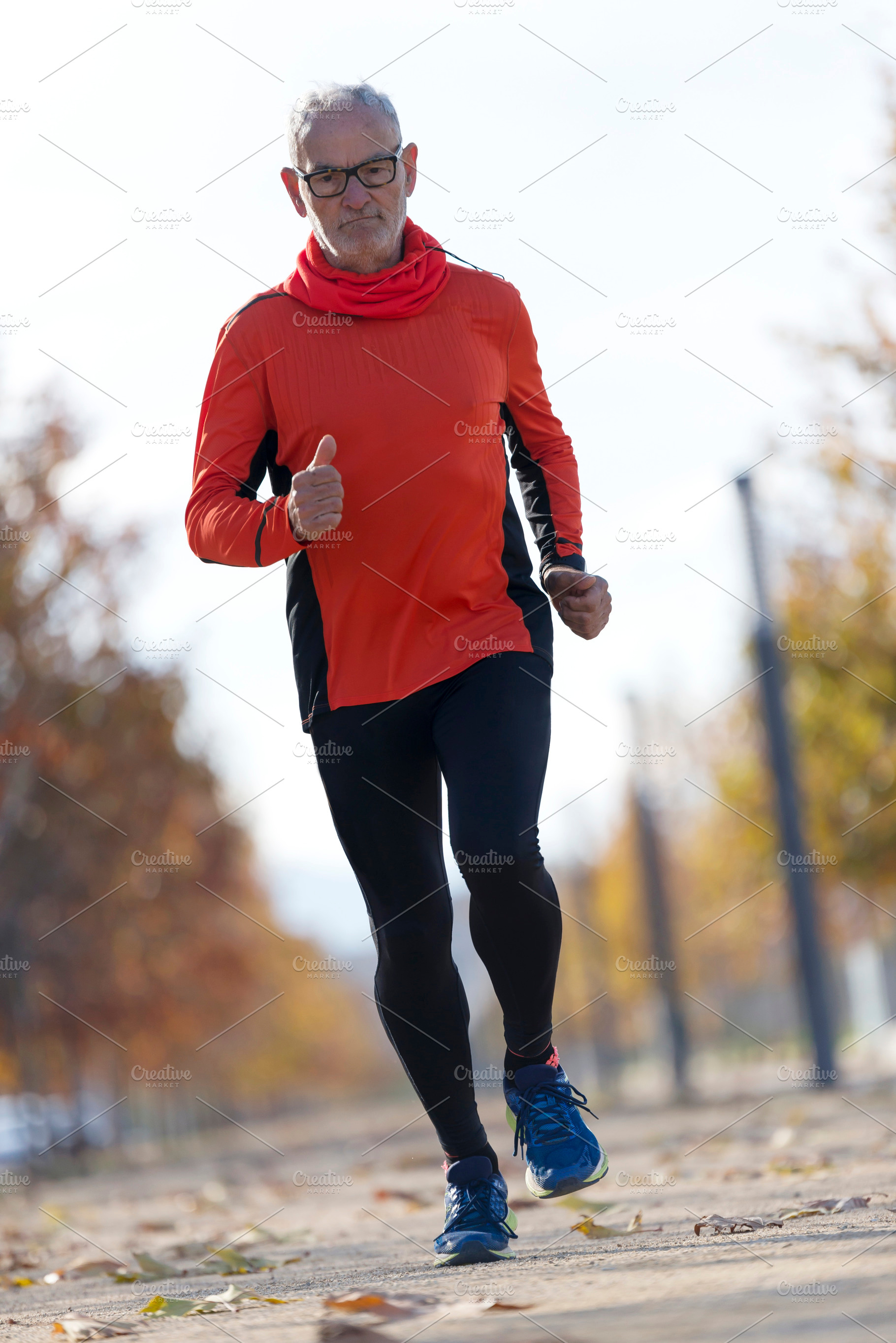 Senior man running outdoors in sportswear, a Sports & Recreation Photo by RF Images