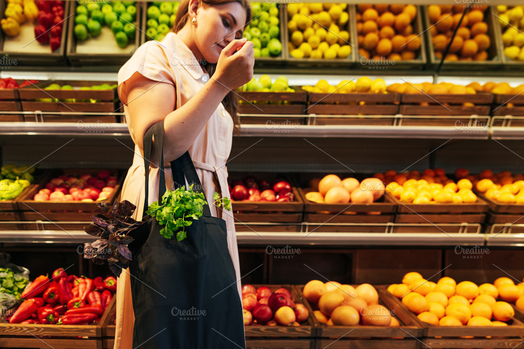 Young woman holding a bag, a Food & Drink Photo by Artem Varnitsin