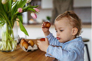 Little boy and easter eggs dyed with, a Holiday Photo by HalfPoint