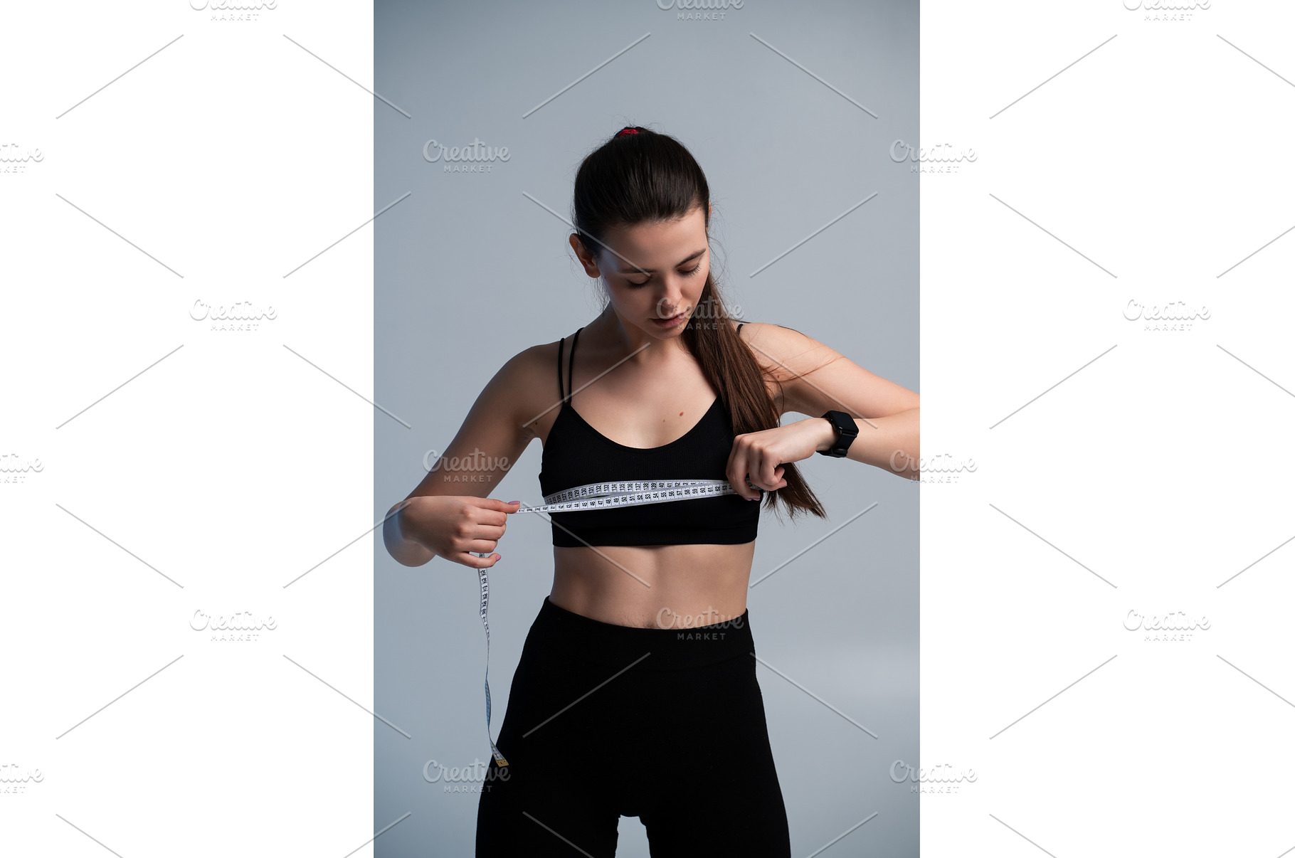 Young woman in sportswear measuring, a Sports & Recreation Photo by volodymyrshtun13795