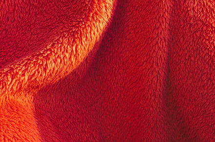 Red blanket texture on the sunlight featuring cloth, blanket, and cotton, an Abstract Photo by rubenchase