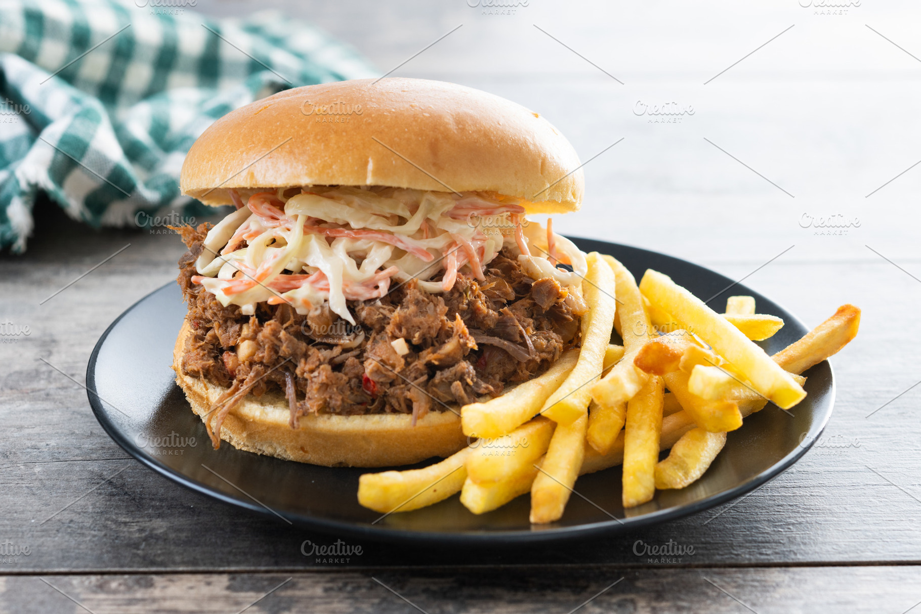 Pulled pork sandwich with coleslaw salad and french fries on woo, a Food & Drink Photo by etorres69