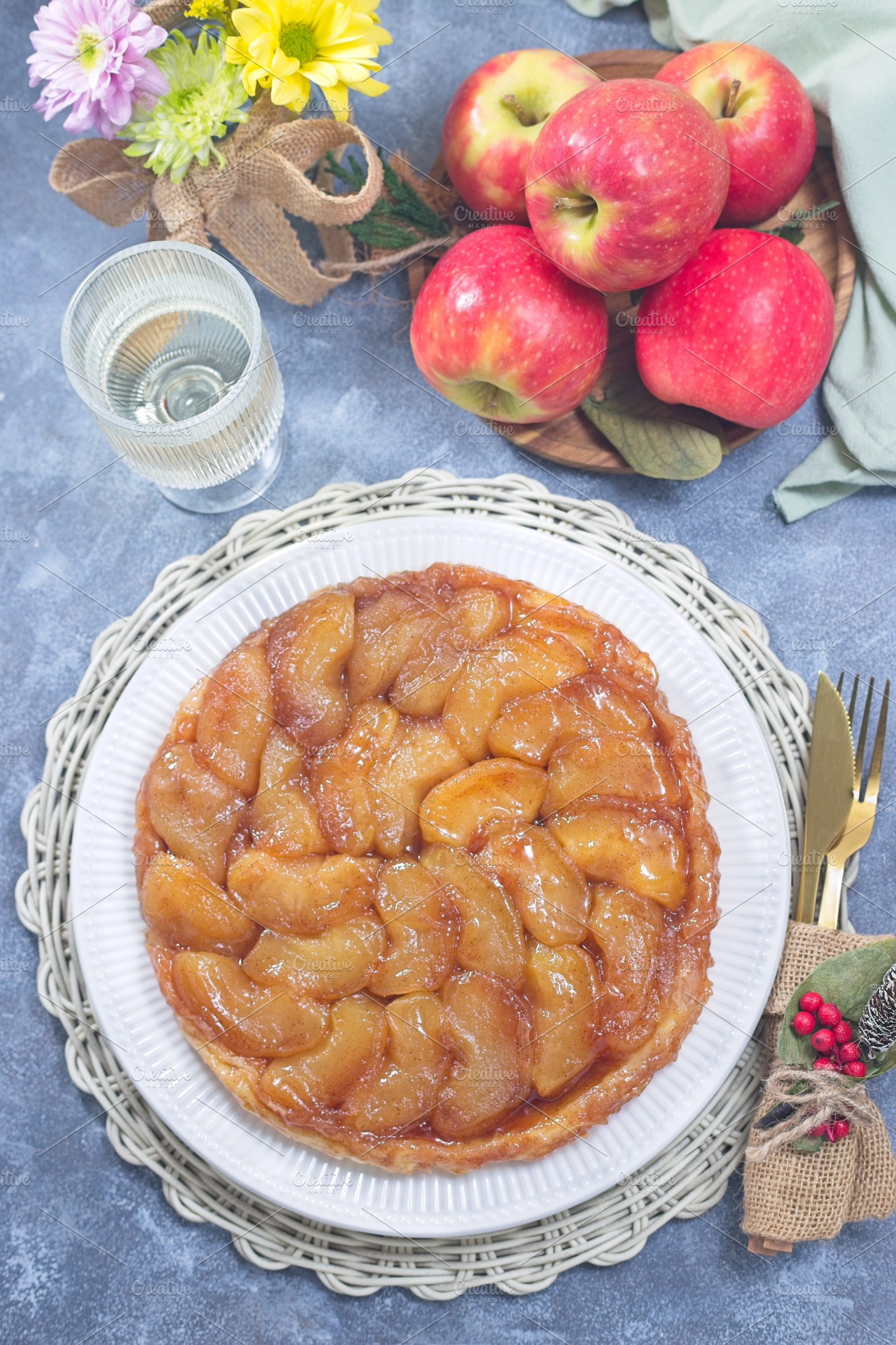 Apple Tart Tartin on plate, french upside down cake, vertical top view, a Food & Drink Photo by iuliia_n