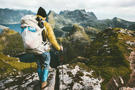 Man with backpack hiking in mountain featuring travel, adventure, and man, a Sports & Recreation Photo by e v e r s t