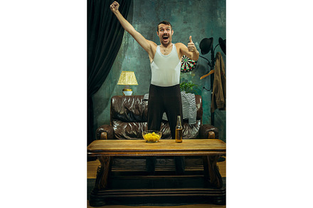 Winner overwhelmed cheerful man stock photo containing match and fan, a Sports & Recreation Photo by Volodymyr Melnyk