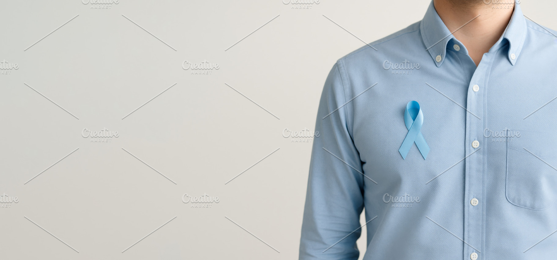 Men health awareness blue ribbon on mans shirt for mens health,, a Photo by Dvoevnore photos