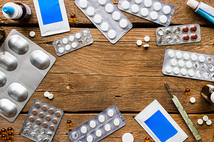 medical pills on a wooden background, a Background Photo by itakdalee