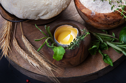 Pizza dough with egg, herbs and flour
