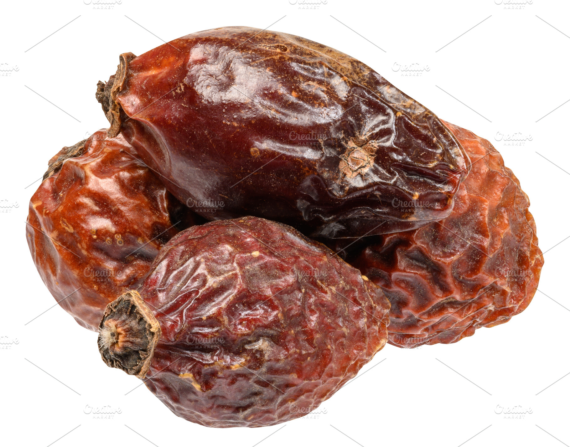 A small pile of dried rose hips with wrinkled skin texture, a Food & Drink Photo by ndanko