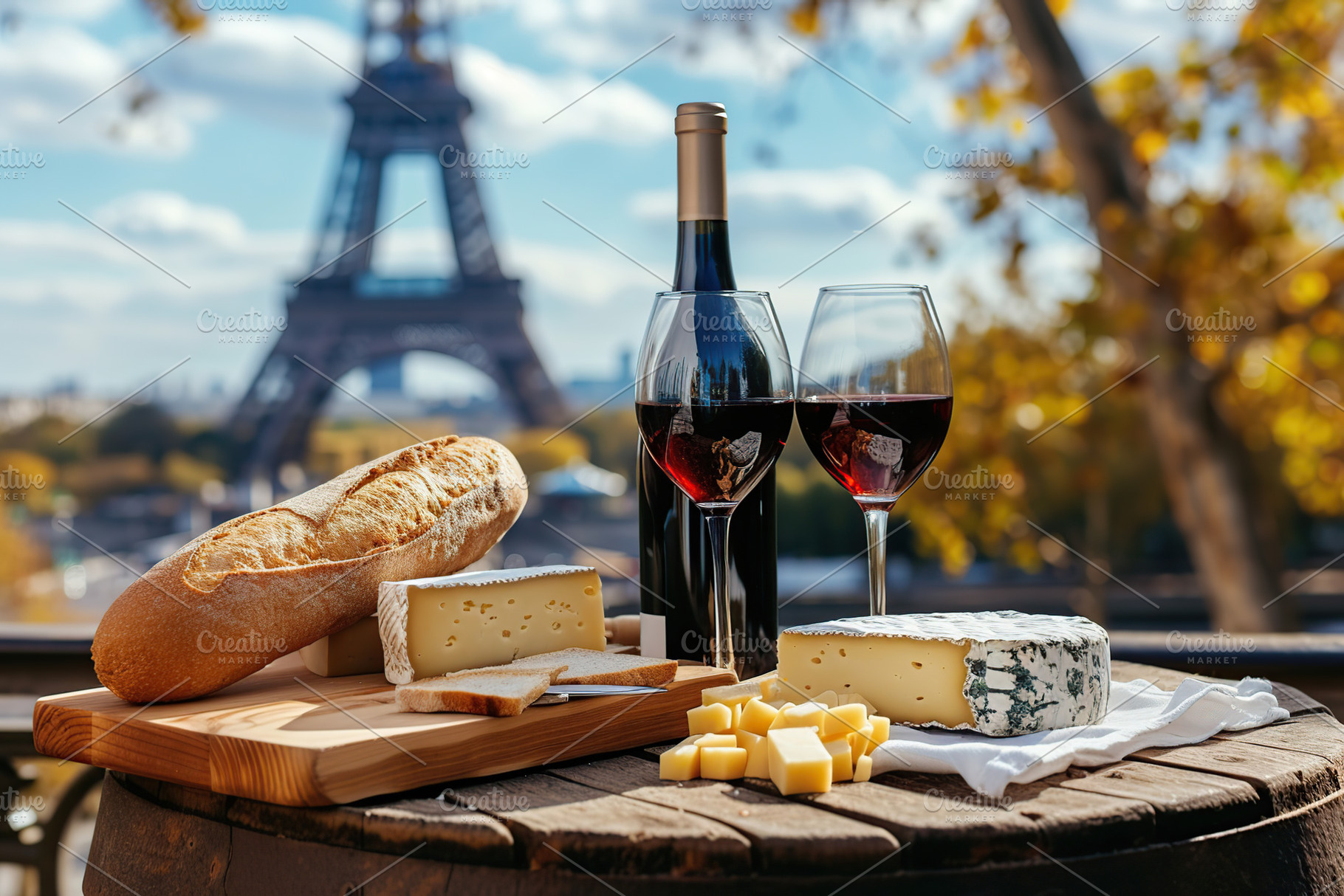 Bottle and wineglasses with fresh bread and cheese on table on E, a Food & Drink Photo by AlyaAnd