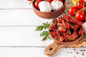 Homemade sun-dried tomatoes in olive oil, a Food & Drink Photo by Rimma