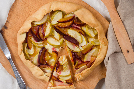 Homemade apple and plum galette table for teatime, a Food & Drink Photo by vimart