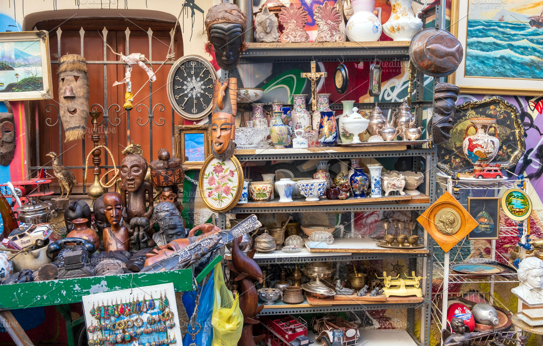 Messy vintage items at a flea market, a Business Photo by BOOCYS