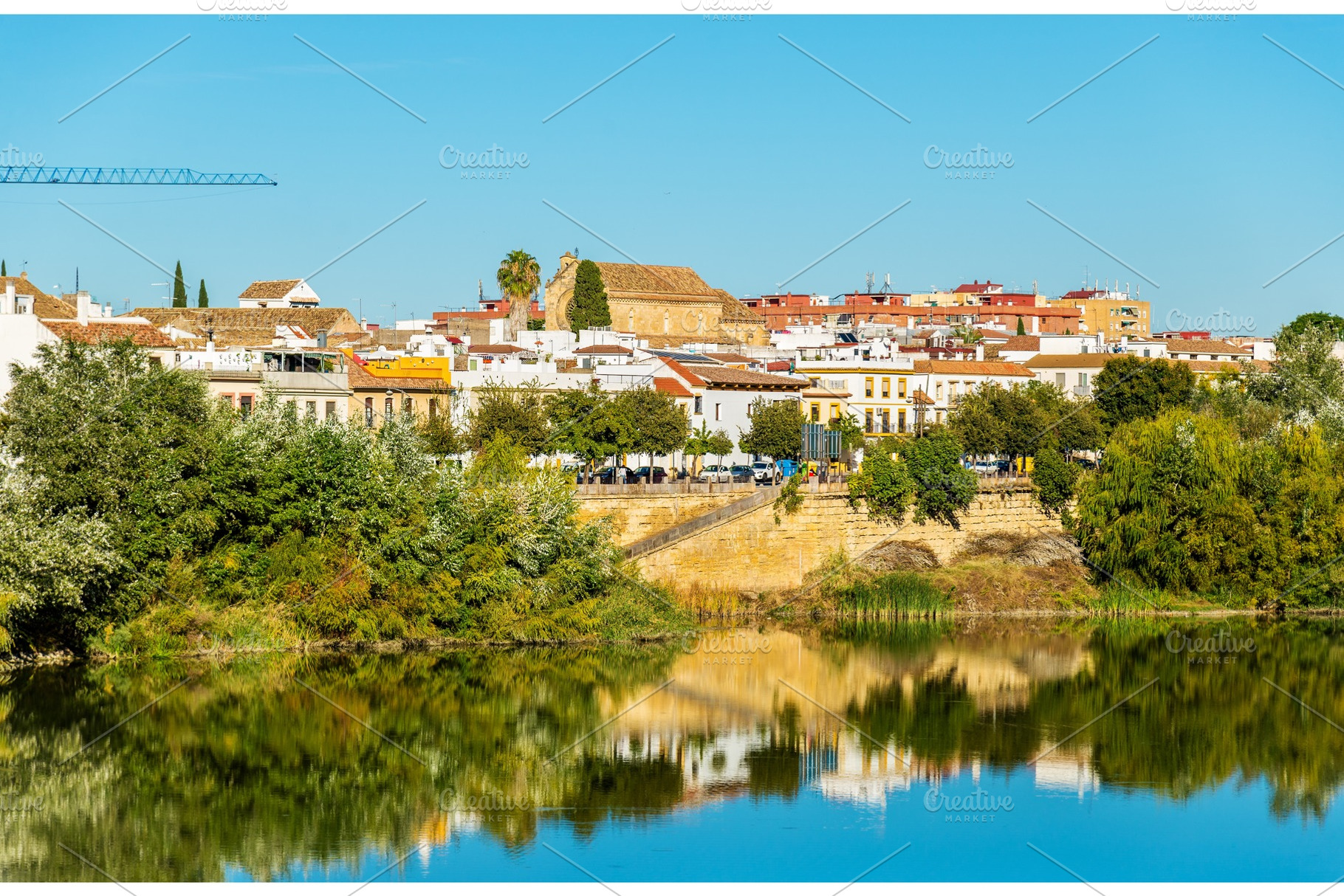 Cordoba city above the guadalquivir river in spain featuring cordoba, spain, an Architecture Photo by Leonid Andronov