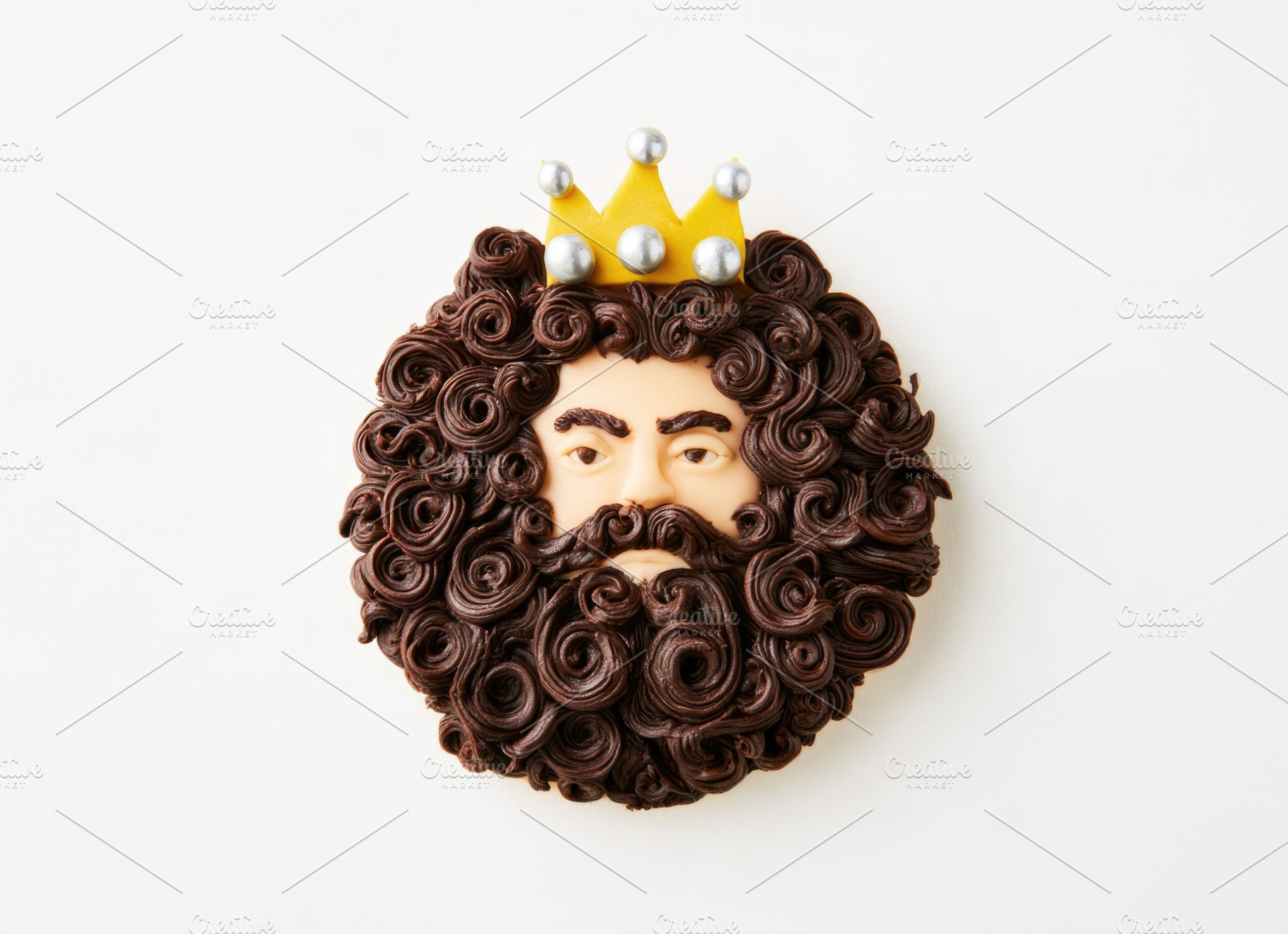 Three Wise Men king cookie with golden crown on white background, a Food & Drink Photo by José Manuel Gelpi