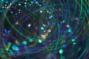 Defocused glowing flicker shimmering glow flare, a Background Photo by Photo Drive Studio
