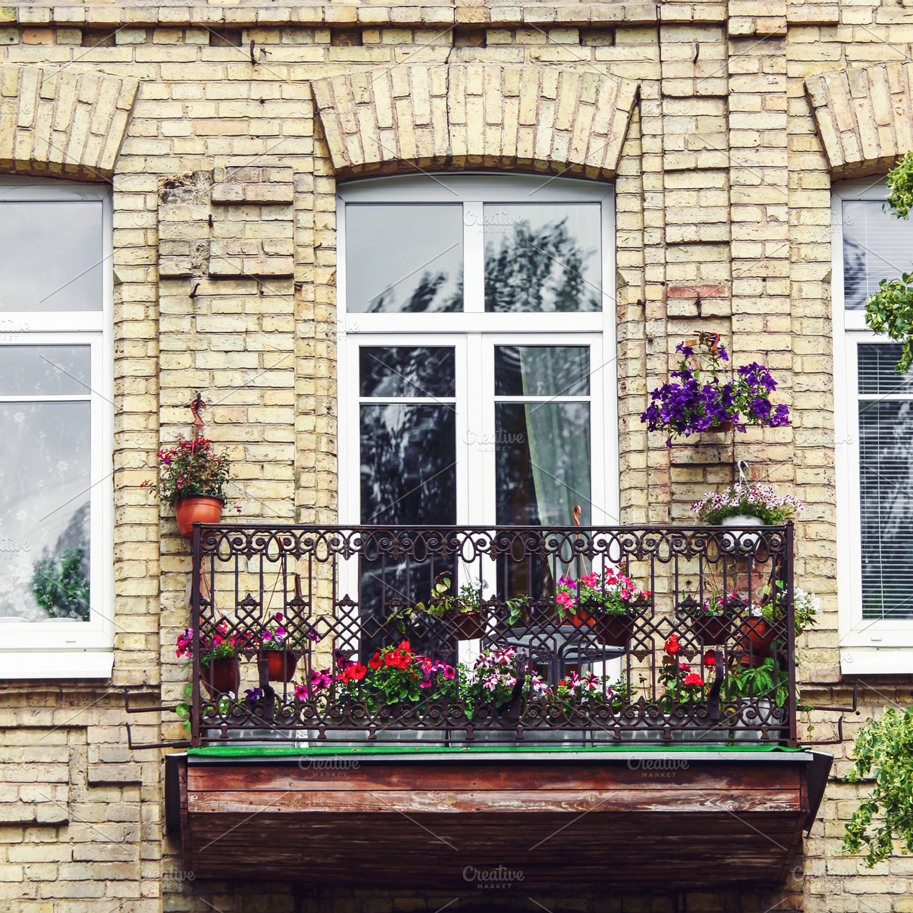 Balcony with flowers at summertime, an Architecture Photo by BOOCYS