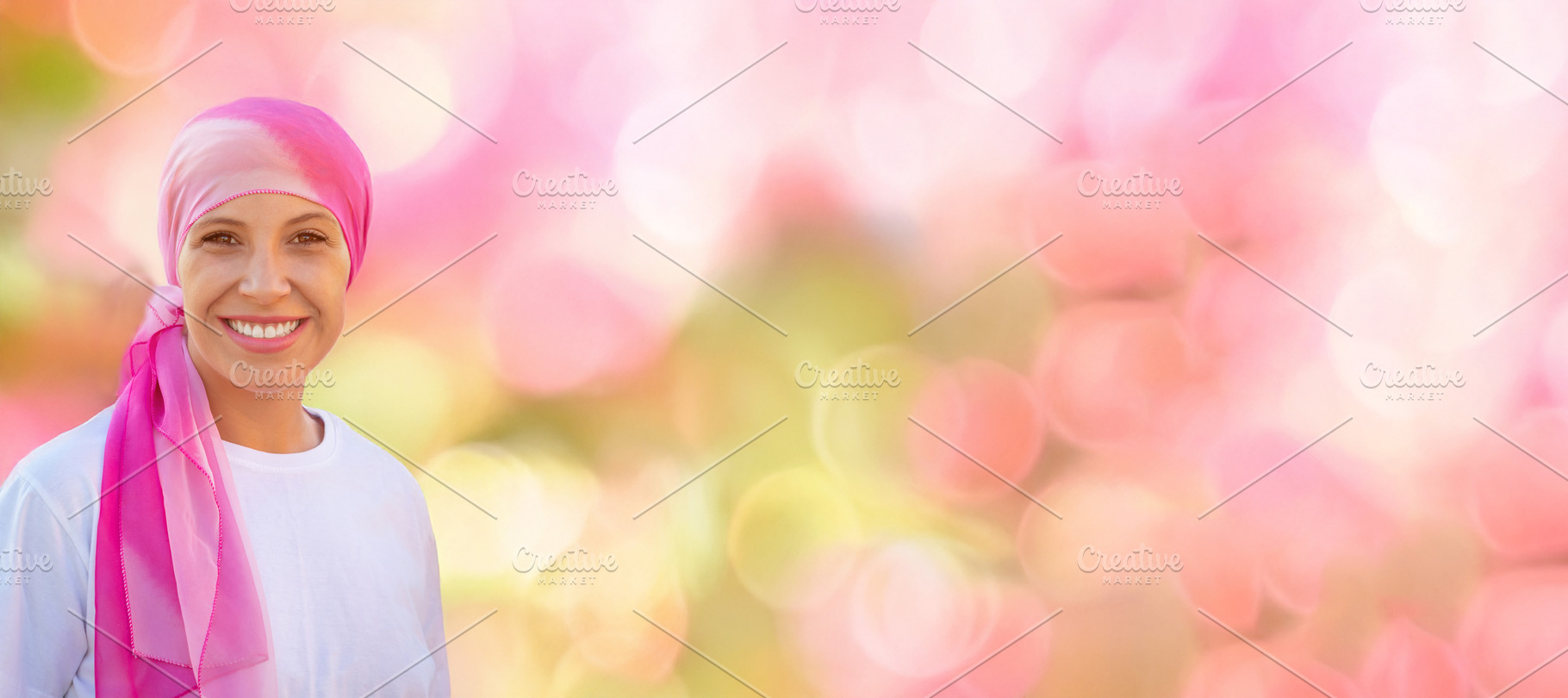 Smiling Cancer Survivor in Pink Headscarf with Soft Bokeh Copy S, a Person Photo by José Manuel Gelpi