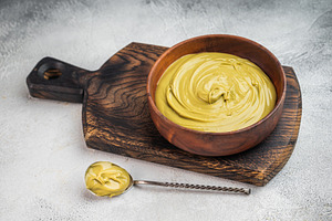 Sweet pistachio cream spread with rich green color served in woo, a Food & Drink Photo by composter-box@mail.ru