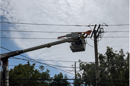 Electricians repairing wire of the, an Industrial Photo by Ungvar Studio