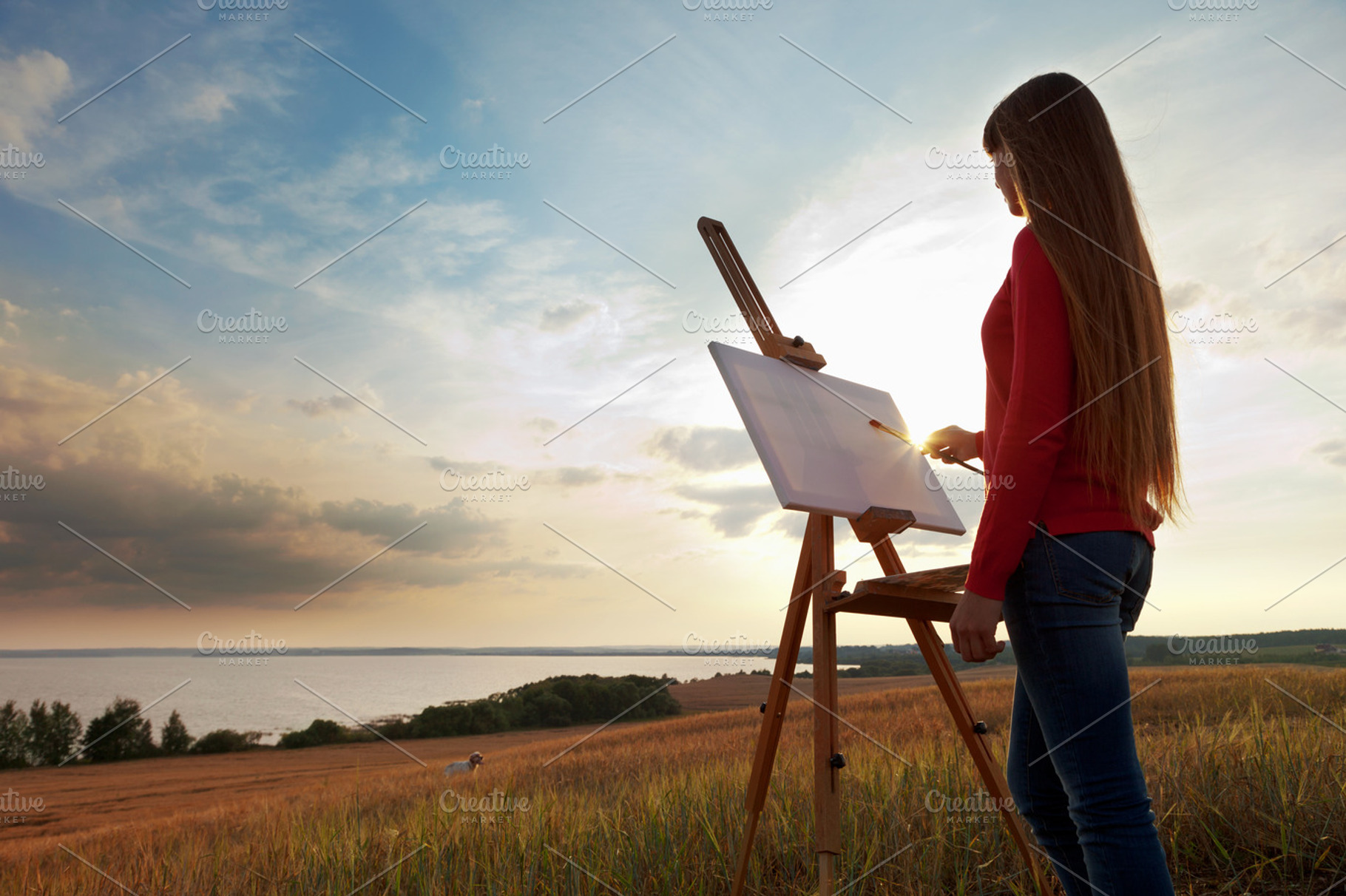 Artist painting an sea landscape, an Arts & Entertainment Photo by chamillewhite