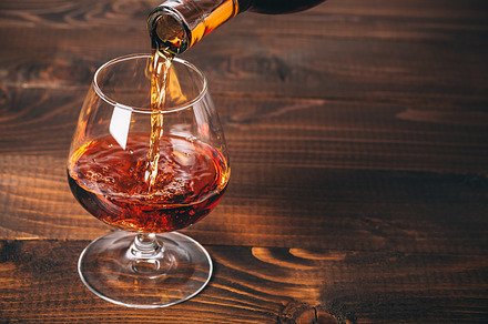 Pouring brandy stock photo containing action and alcohol