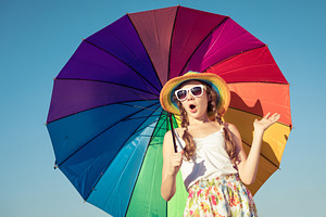 Teen girl with umbrella stock photo containing kid and beach