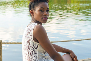 beautiful young woman by the river AI generated, a Photo by WorldOfPhotos