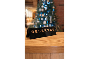 Reserved table sign in festive, a Food & Drink Photo by Jan Jack Russo Media