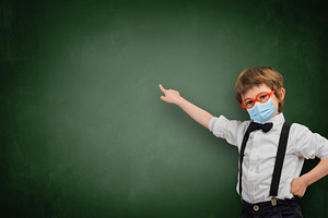 Child with sanitary mask points an e stock photo containing schoolboy and