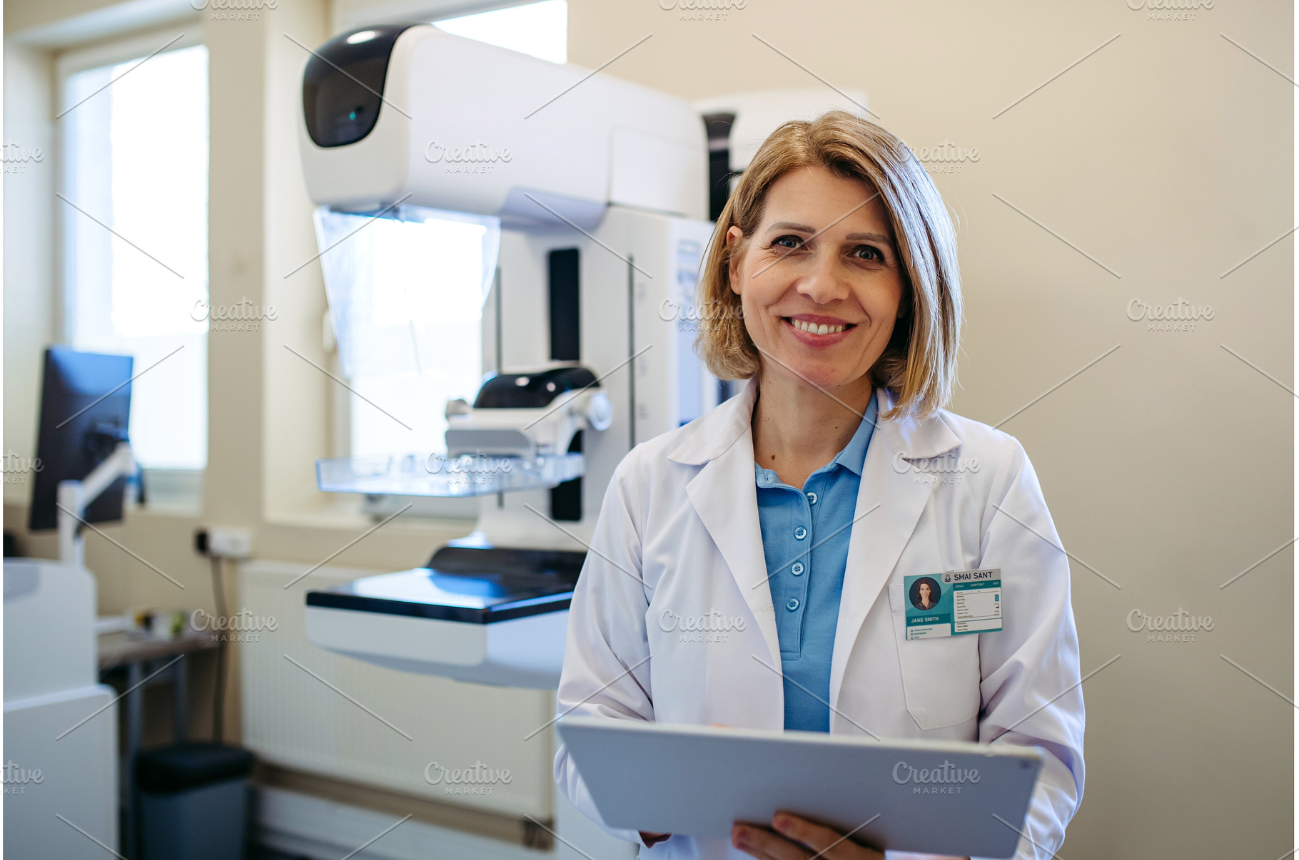 Smiling doctor standing next to, a Person Photo by HalfPoint