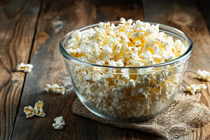 Popcorn on wood color background.Food and snack concepts ideas.Minimal style to, a Food & Drink Photo by Budarinphoto