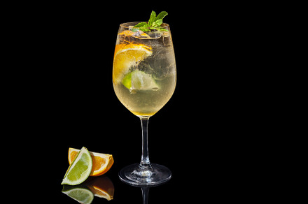 Alcoholic orange juice on a black background stock photo containing orange, a Food & Drink Photo by Photostock