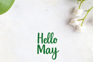 Lily of the valley with text Hello May on light color background, a Photo by Dvoevnore photos
