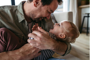 Mature father playing with little, a Person Photo by HalfPoint