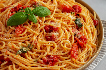 Homemade Spaghetti With Fresh Tomato Sauce on a Plate, side view, a Food & Drink Photo by LiudmylaChuhunova