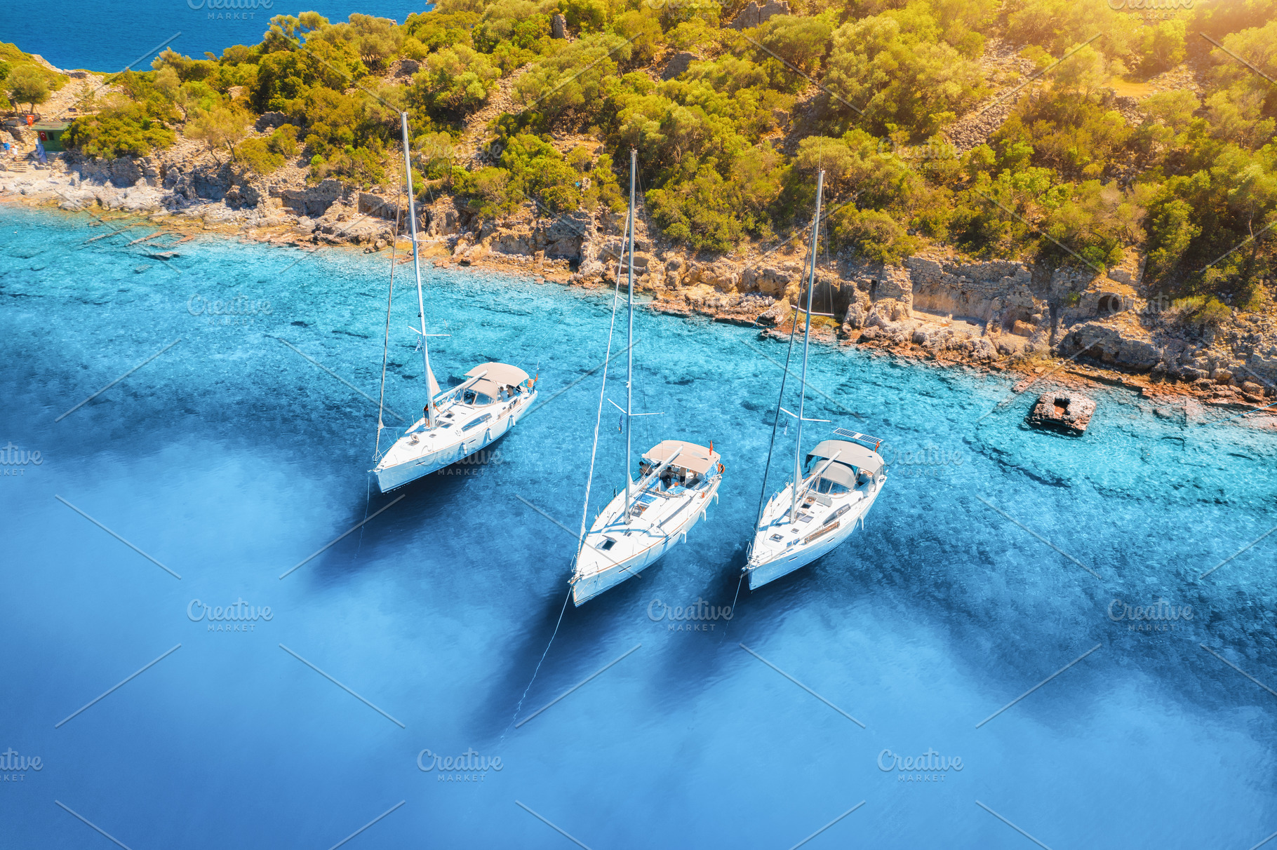 Aerial view of beautiful yachts, boats on the sea bay at sunrise, a Nature Photo by den-belitsky