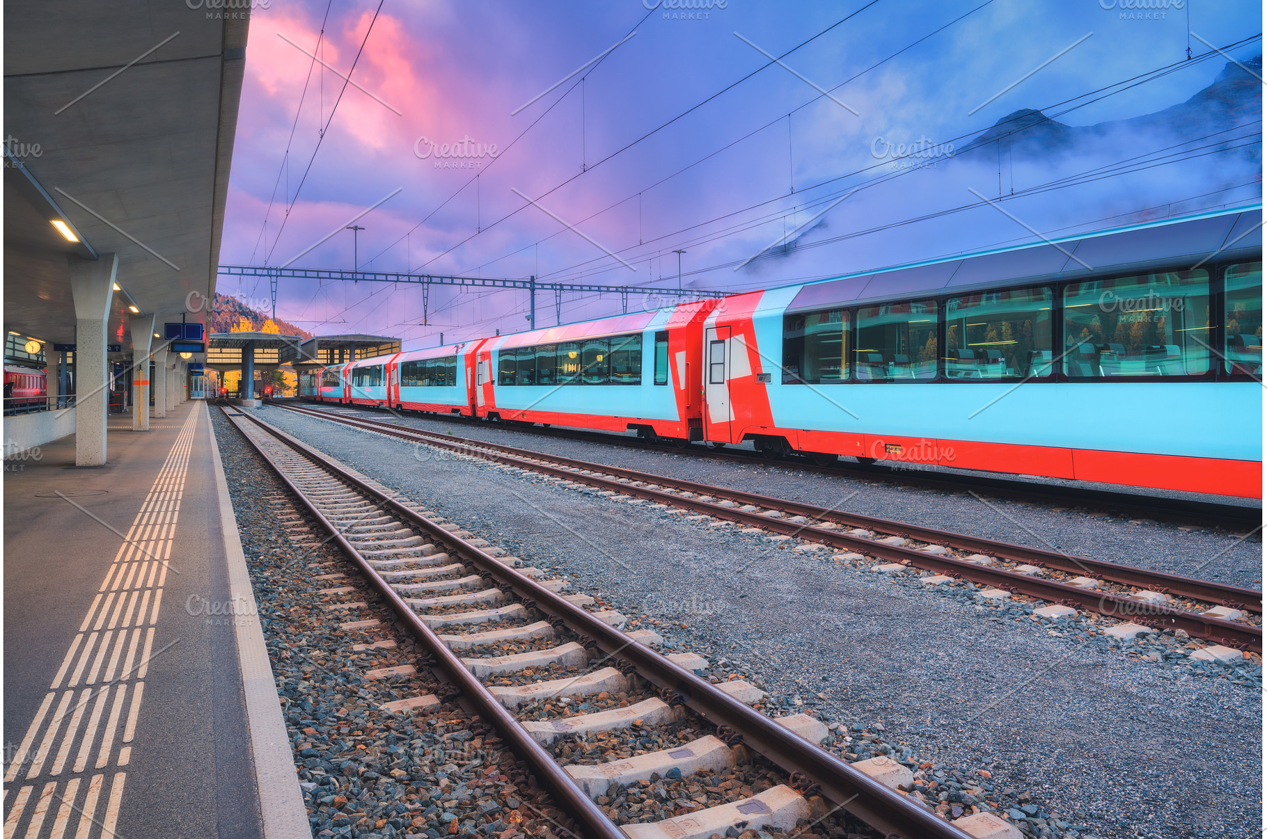 Red and blue modern passenger train, a Transportation Photo by den-belitsky