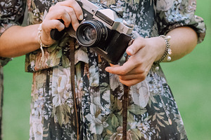 woman with a camera in hands