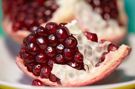 Natural antioxidant, healthy pomegranate seeds. Close up of raw red ripe pomegr, a Food & Drink Photo by Rohan Photography