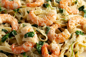Homemade Creamy One-Pot Spinach Shrimp Pasta on a Plate, side vi, a Food & Drink Photo by LiudmylaChuhunova
