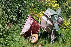 Red Wheelbarrow and Cement Mixer in, an Industrial Photo by Perpis