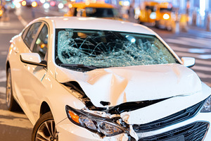 Damaged white car in city at night, a Transportation Photo by AlyaAnd