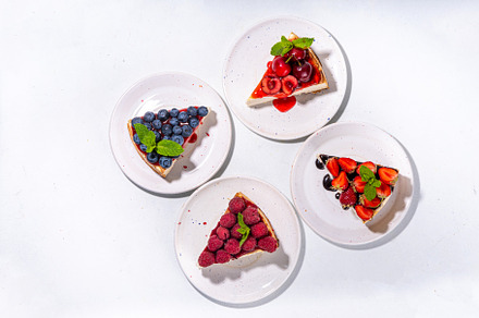 Summer cheesecake slices with various berry, a Food & Drink Photo by Rimma