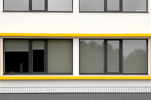 Modern building with yellow window, an Architecture Photo by BOOCYS