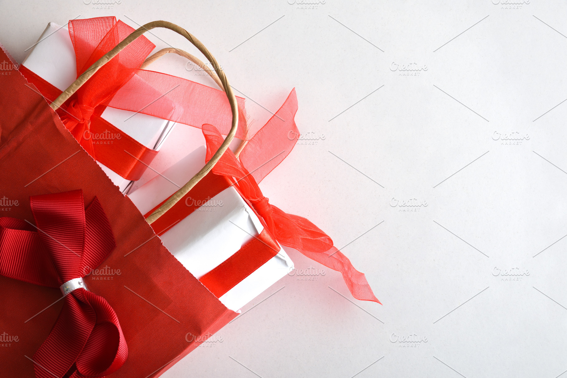 Gift concept featuring a red shopping bag with gifts, a Holiday Photo by Davizro's Market