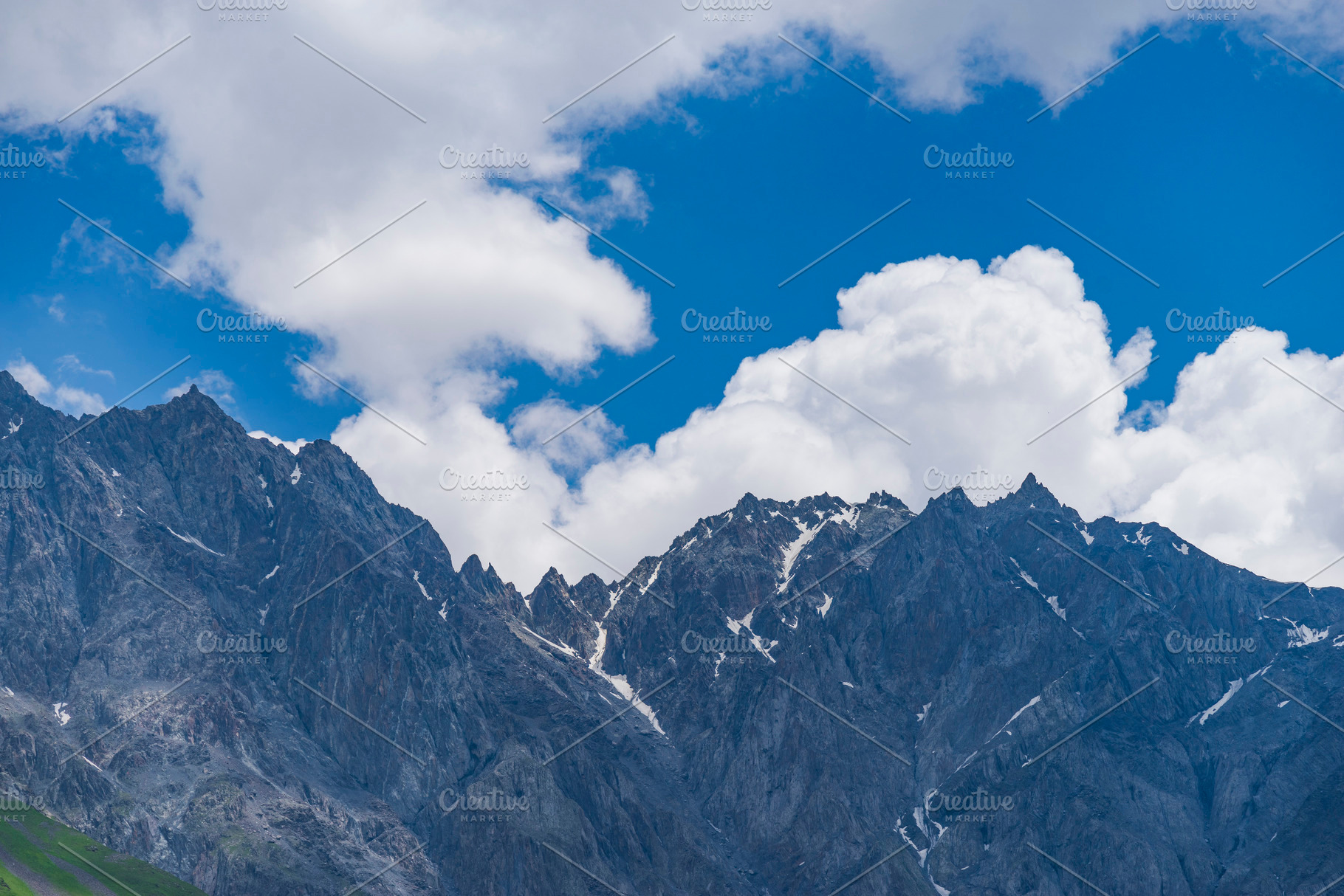 Sharp rocks of Caucasus ridge under blue cloudy sky with copy sp, a Photo by Pictures for you!!!!!!!!!